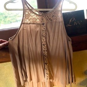 A tope tank with a lace pattern down the Center